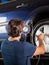 Mechanic Checking Gauge While Inflating Car Tire