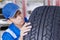 Mechanic checking a textured tire