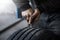 mechanic closes a hole in a tire in a workshop