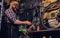 Mechanic cutting and polish bicycle part in a workshop.