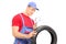 Mechanic examining tire through magnifying glass