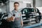 Mechanic handling keys of a car at the service garage