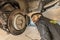 Mechanic Hands Replace Brake Pads on Car