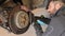 Mechanic Hands Replace Brake Pads on Car