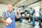 Mechanic holding a car key atauto repair shop