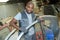 Mechanic holding vehicle panel in vehicle breakers