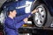 Mechanic Inflating Car Tire