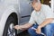 Mechanic Inflating RV~s Tire