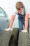 Mechanic inspects the automobile tires