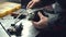 A mechanic installs door closers in a car lock