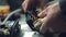 A mechanic installs door closers in a car lock