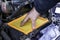 the mechanic installs a new filter element in the car\'s air filter