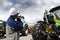 Mechanic pointing at large farming tractors