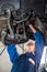 Mechanic Repairing Car In Automobile Shop