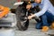 Mechanic repairing motorcycle in repair shop, Man repair motobike in garage, mechanic fixing motocycle engine