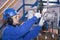 The mechanic - the repairman sets up a gas meter, locksmith repair instrumentation, worker in personal protective equipment, close