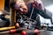 Mechanic repairs a carburetor