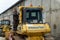 A mechanic repairs a Komatsu D61EX bulldozer