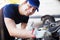 Mechanic servicing a car engine