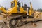 Mechanic servicing the Komatsu D475A bulldozer.