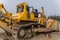 Mechanic servicing the Komatsu D475A bulldozer.