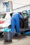 Mechanic vacuuming the car interior