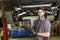 Mechanic working on car in his shop