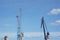 Mechanical cranes in the harbor with a clear blue sky in the background