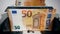 Mechanical device is counting euro banknotes