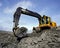 Mechanical excavator working in a quarry