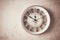 Mechanical wall clock, transparent , beige color , on a light painted wall, rustic style, vintage, no people,