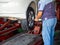 Mechanician changing car wheel in auto repair shop