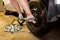 Mechanician changing car wheel in garage. Man exchanging tire. Tire service.