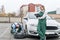 Mechanics changing wheel of a car at service