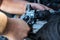 Mechanics with dirty hands repair broken starter on car/ Automotive service