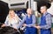 Mechanics examine car at repair shop