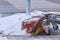 Mechanized cleaning of the sidewalk from snow with a rotating snowplow brush. The work of utilities after a snowfall