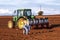 Mechanized planting of peanuts on a farm in Herculandia County