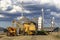 Mechanized soybean harvest in front of Silo