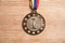 Medal awards for winner on wood background