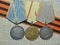 Medals `For the Defense of Stalingrad`, `For military merit ` on the background of the St. George`s ribbon.Awards of the soldier.
