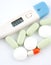 Medecine stuff. Digital thermometer and pills