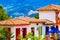 Medellin, Colombia - December 19, 2017: Facade view of clay rooftops with some colorful buildings in Pueblito Paisa in