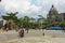 Medellin, Colombia - March 01, 2020: Tourists walking at Botero Plaza in Medellin, Colombia. At the background is Palace of Cultur