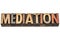 Mediation, word in wood type