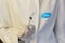 Medic ,scientist, pharmacist holding Syringe with Pfizer logo on lab coat. Coronavirus, Covid-19 vaccine concept