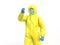 Medic in yellow hazmat suit looking on blood test