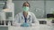 During a medical appointment at the clinic, a female doctor collects the patients medical history at a standing table