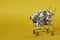 Medical background or concept. Close-up of a shopping trolley filled with colorful pills. Cart from the supermarket with different