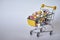 Medical background or concept. Close-up of a shopping trolley filled with colorful pills. Cart from the supermarket with different